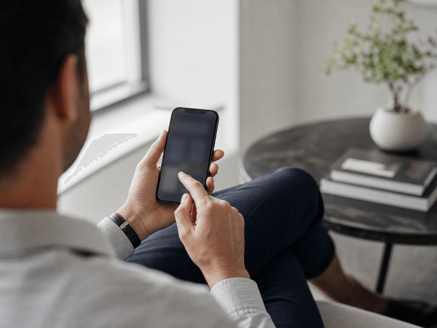 Person using the mobile wealth app on a smartphone